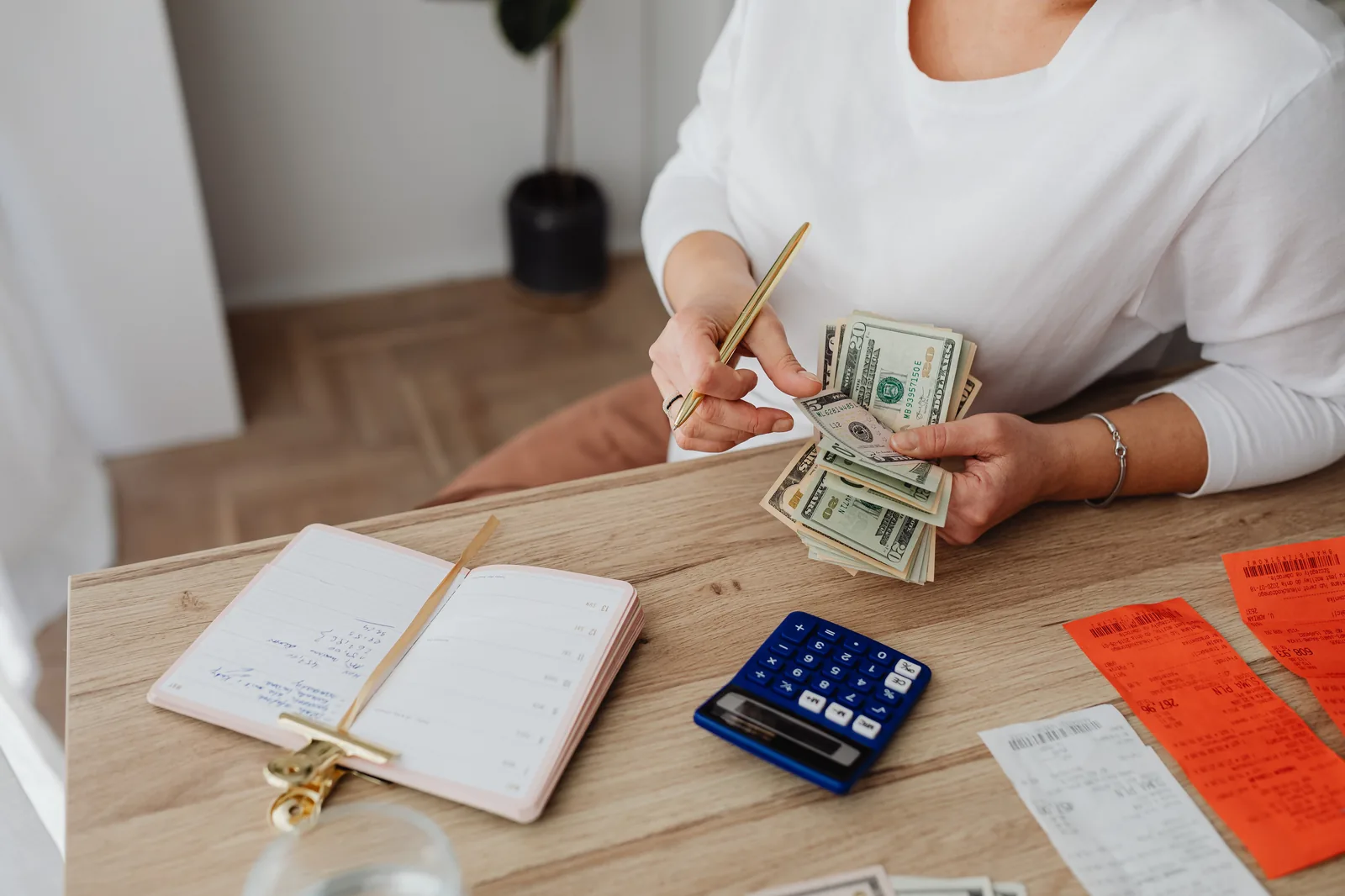 A business owner reviewing financial records at a moment of decision.