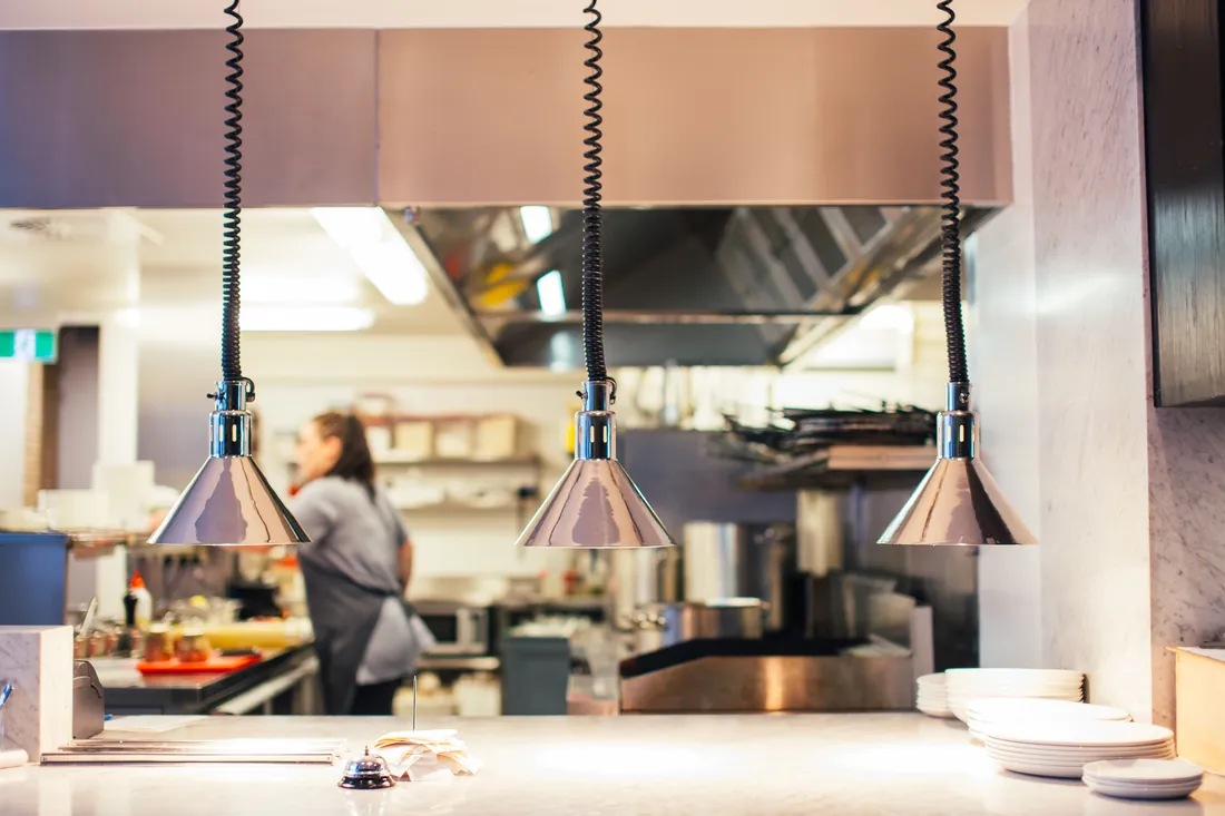 Restaurant line kitchen with chef at work