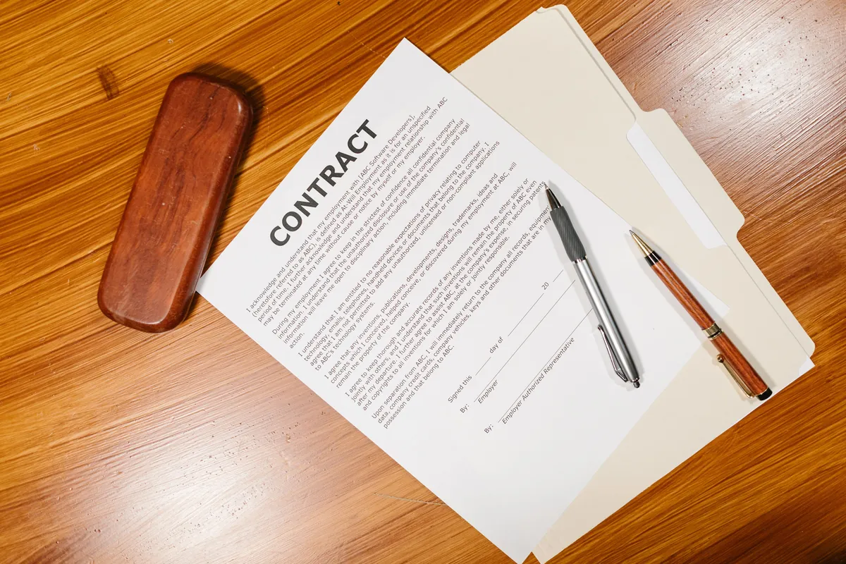 A contract document with pens