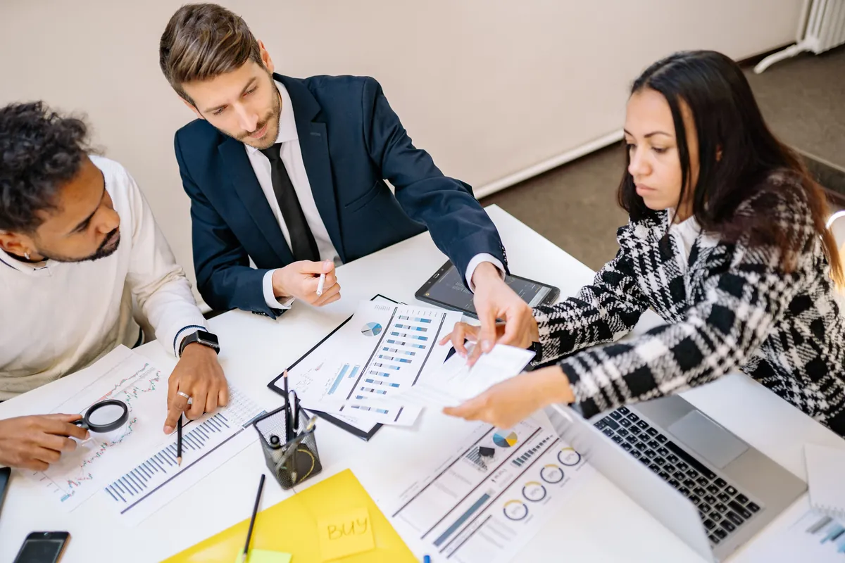 Advisors reviewing financing options and charts